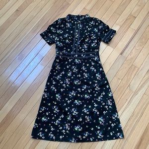 New in bag!  Black dress with floral pattern.